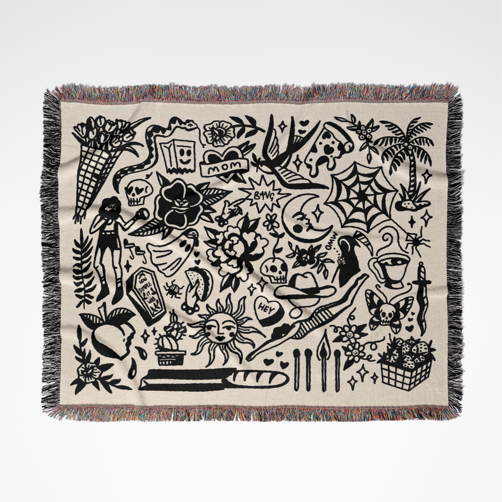 Woven blanket with black graphics on a white background