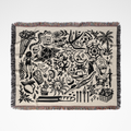 Woven blanket with black graphics on a white background